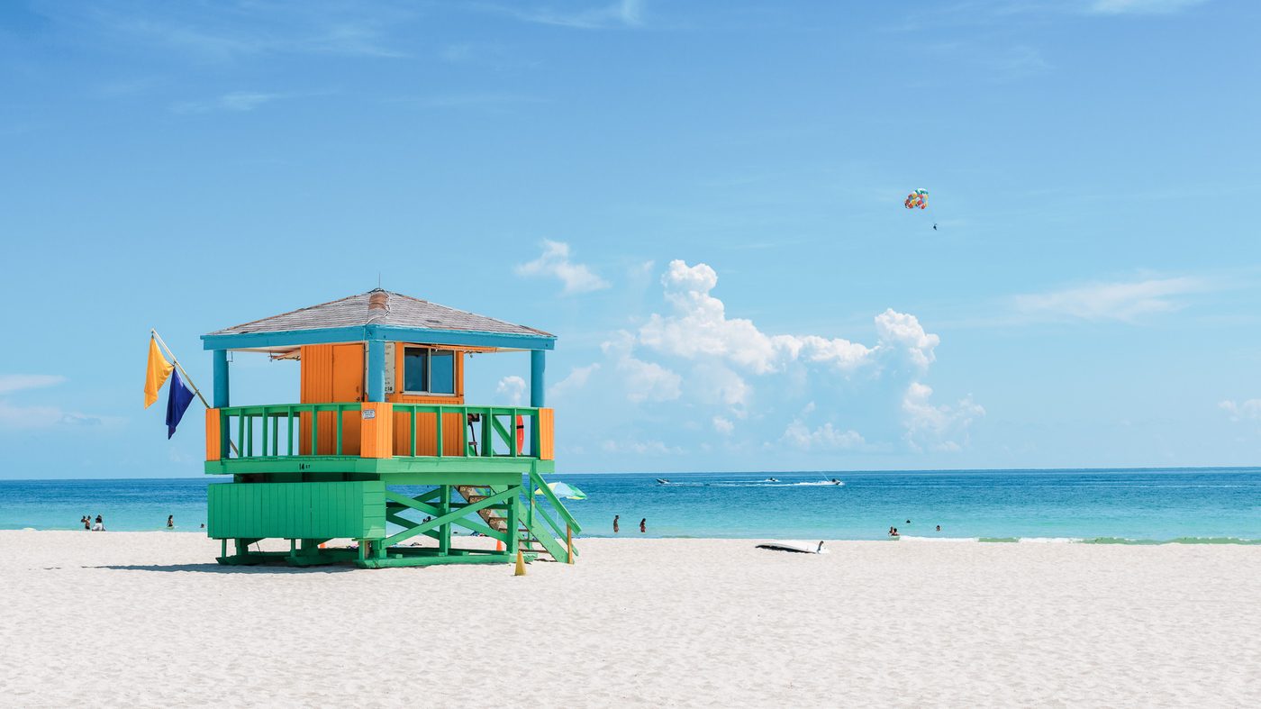 The South Beach shoreline seen from the sand, with a lifeguard tower
